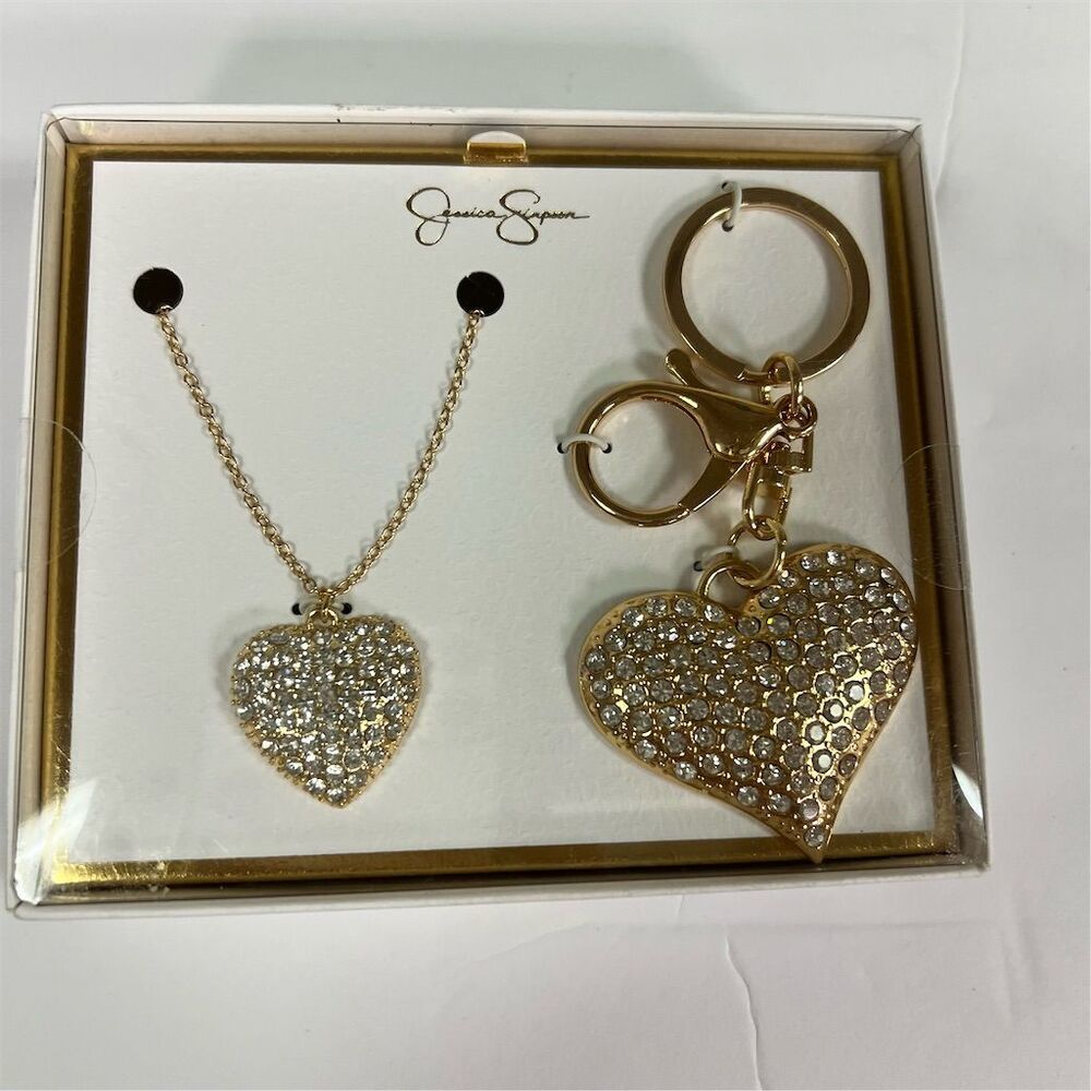 Jessica Simpson set of Goldtone Pave Crystal Heart Necklace with Keychain.
New